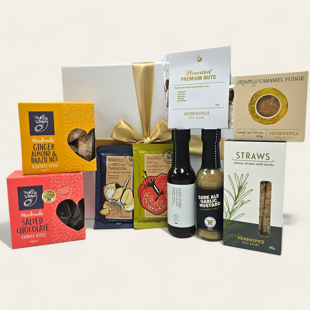 Gourmet gift box filled with sauces, nuts, biscuits, and dips for food lovers; beautifully packaged with a ribbon.