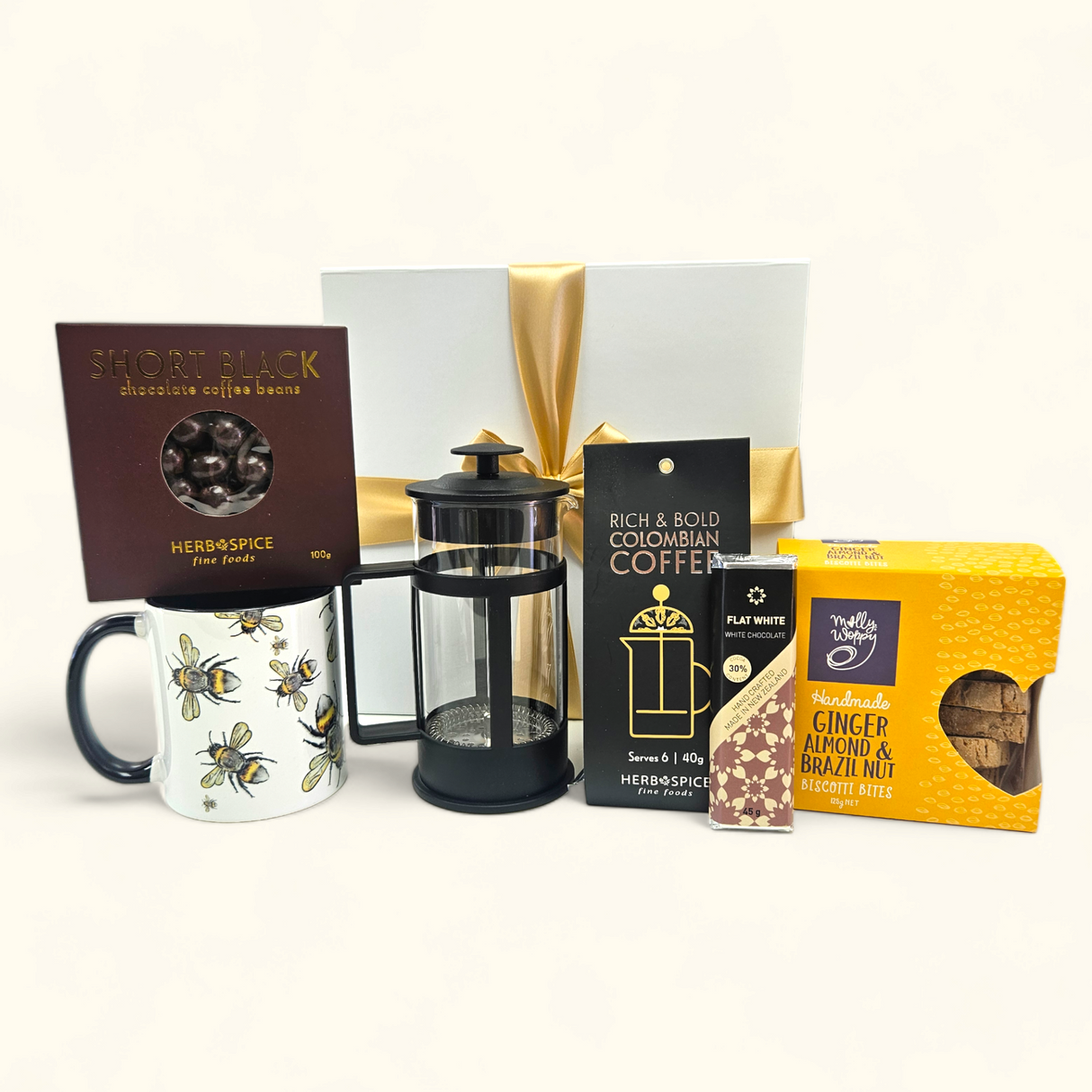 Elegant gift box for coffee lovers with unique mug, plunger, gourmet biscotti, premium coffee, and chocolates.