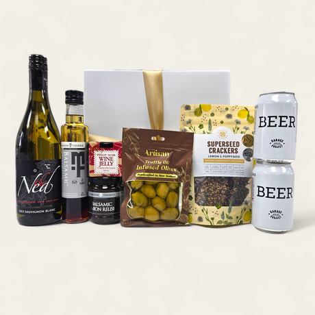 Elegant gift box featuring gluten-free gourmet treats for celebrations, including wine jelly, artisan oils, and gourmet crackers.