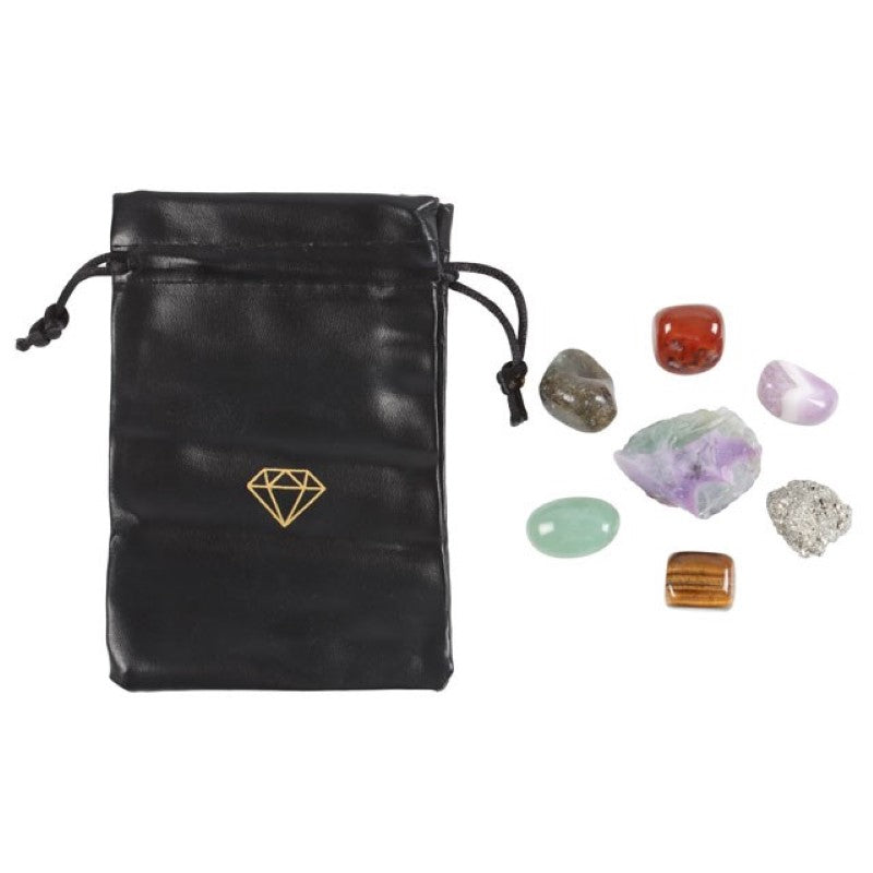 Stylish faux leather bag containing 7 unique crystals for manifestation and abundance, presented in an informative gift box.