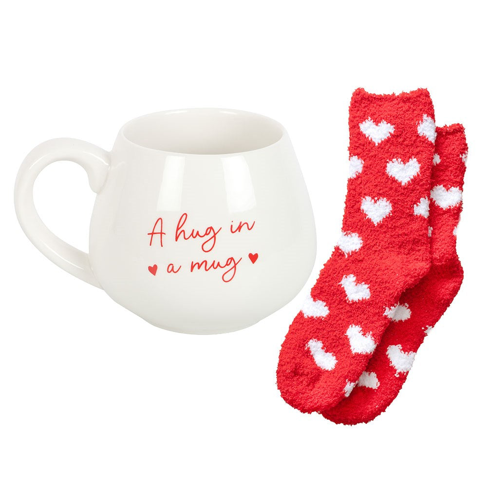 Charming heart mug with cozy socks set, perfect for gifting and enjoying warm beverages.
