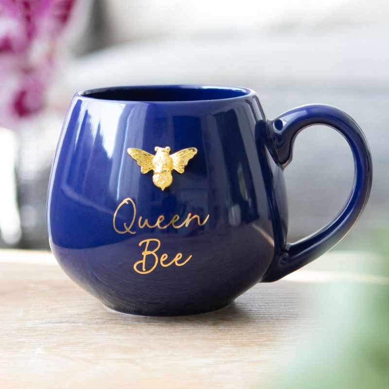 Navy blue Round Queen Bee Mug with bee design and "Queen Bee" gold lettering, perfect for stylish sipping.