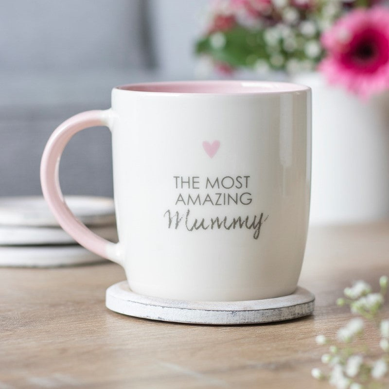 Ceramic mug with a heartfelt message for mums, featuring a pink heart accent and durable, dishwasher-safe design.