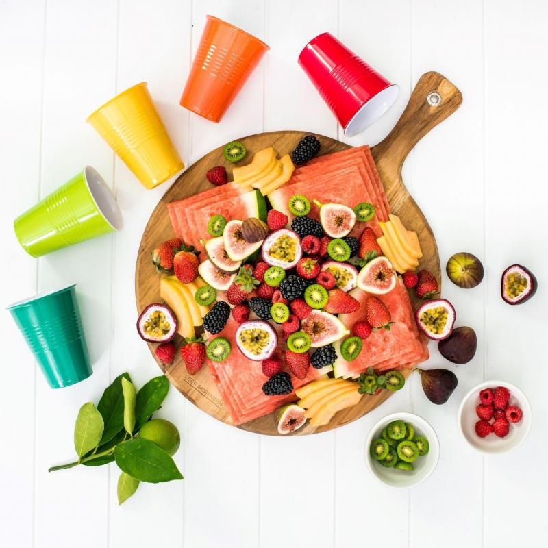 Acacia Round Serving Board with unique grain, reversible design, perfect for serving appetizers and cheese.