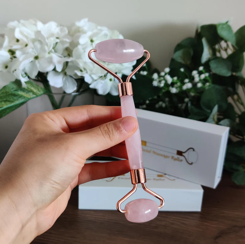 Rose Quartz Facial Roller with two sizes for targeted skincare, promoting circulation and a radiant glow in an elegant design.