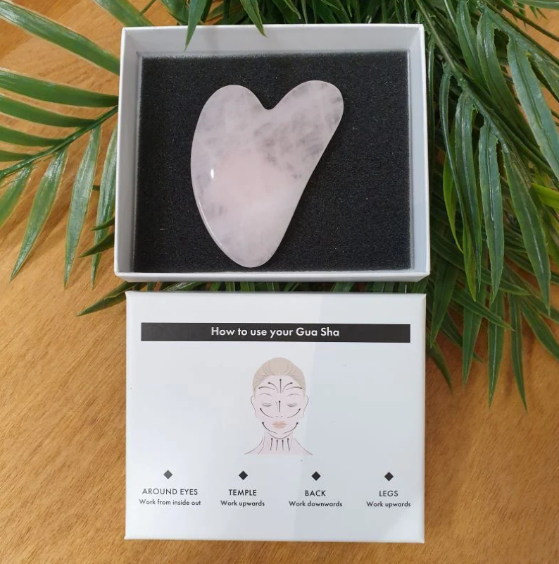 Rose Quartz Gua Sha tool for facial toning, stress relief, and enhanced skincare absorption in a luxurious gift-ready package.