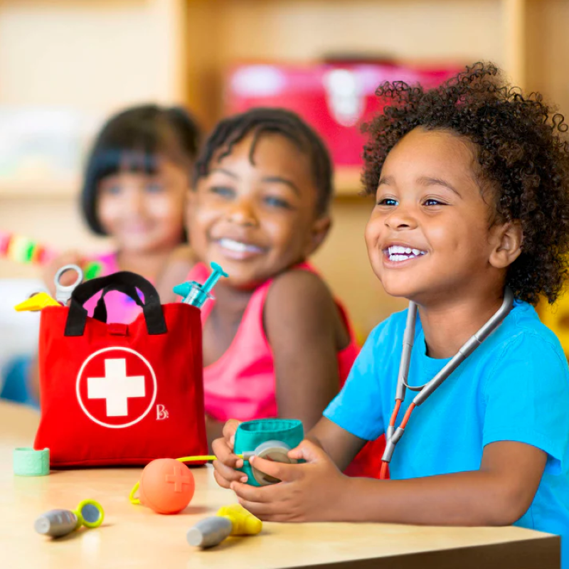 Realistic Doctor Care Kit for toddlers, featuring play stethoscope, bandage, thermometer, and more in a portable fabric bag.