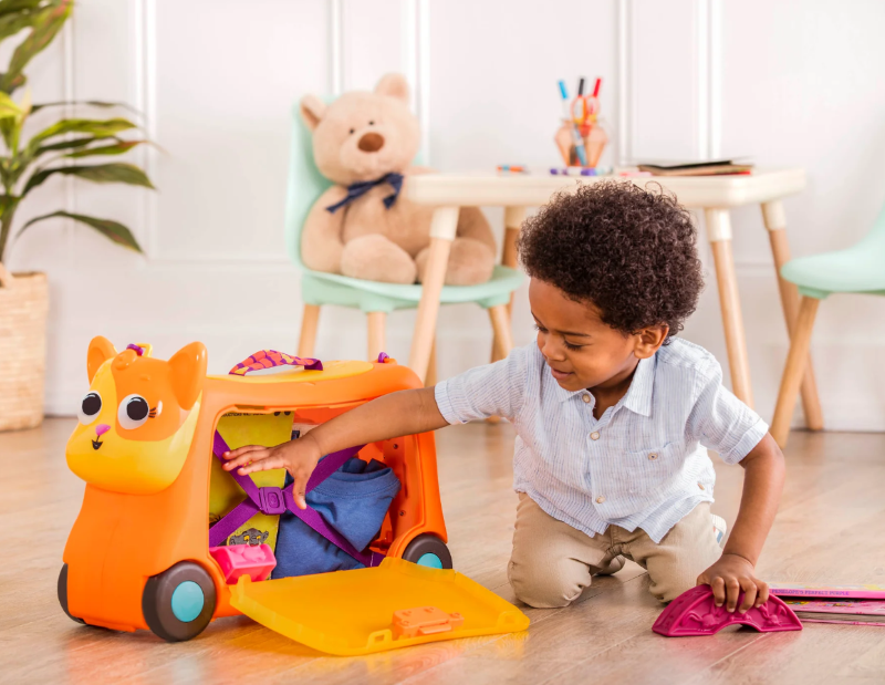 Colorful ride-on suitcase for kids, featuring storage, a fish handle, sound effects, and designed for playful adventures.