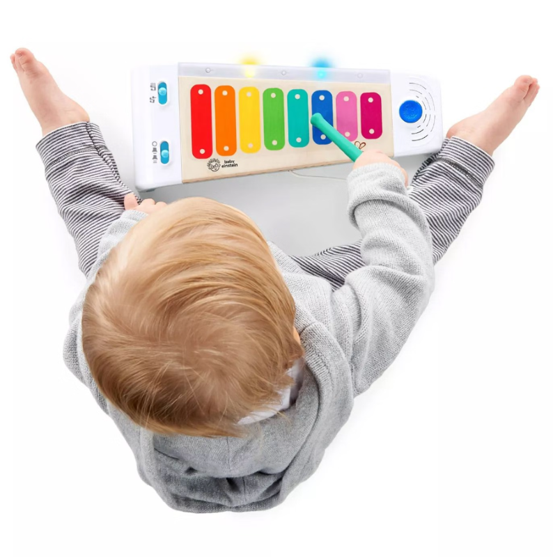 Colorful wooden xylophone for babies with Magic Touch technology, playing over 30 melodies to enhance creativity and motor skills.