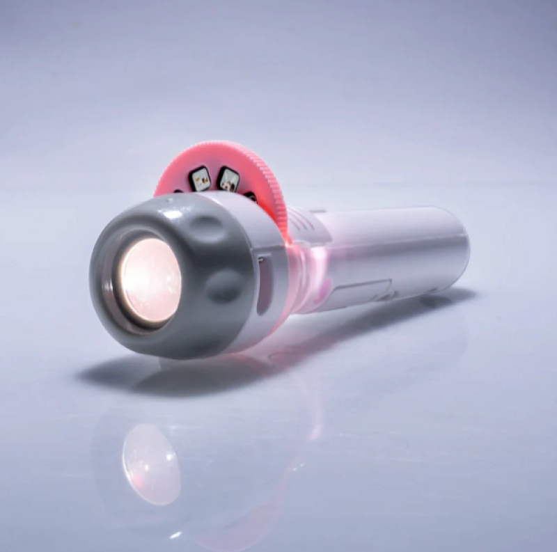 Compact projector torch casting adorable cat images, perfect for creating a whimsical atmosphere in any room.