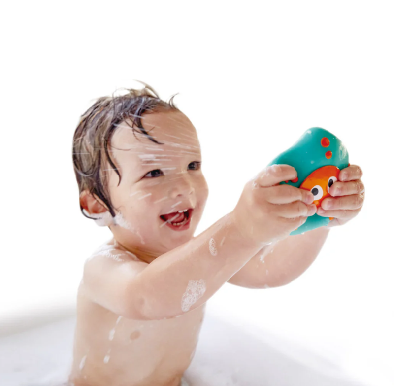 Colorful ocean-themed bath toys with an octopus and starfish designed for imaginative play and fine motor skill development.