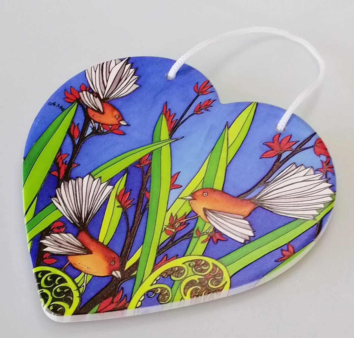3D ceramic heart wall hanging featuring two Fantails, symbolizing New Zealand wildlife with intricate textures.