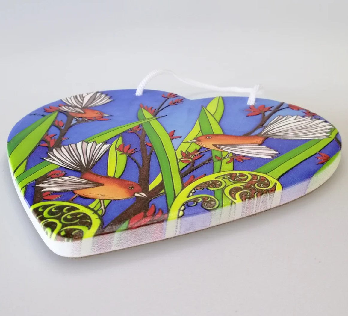 3D ceramic heart wall hanging featuring two Fantail birds, ideal for enhancing home decor with a touch of New Zealand's beauty.