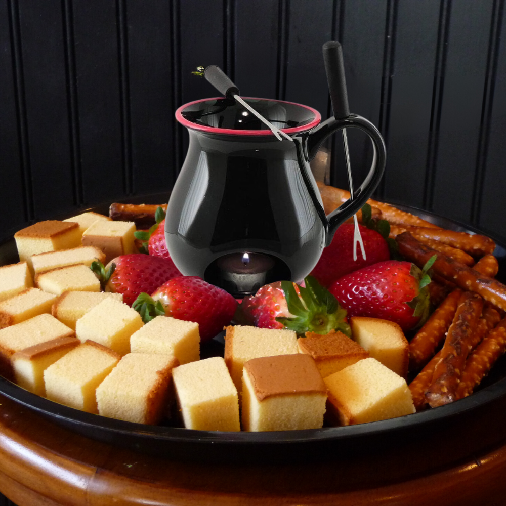 Elegant fondue mug set with forks and tealight candle for a delightful chocolate fondue experience at dinner parties.
