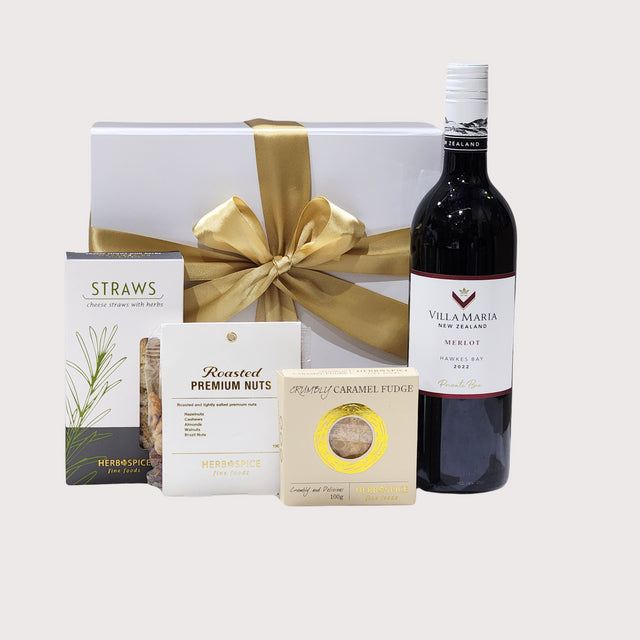 Luxurious gift box featuring New Zealand Merlot and gourmet snacks, perfect for any special occasion.