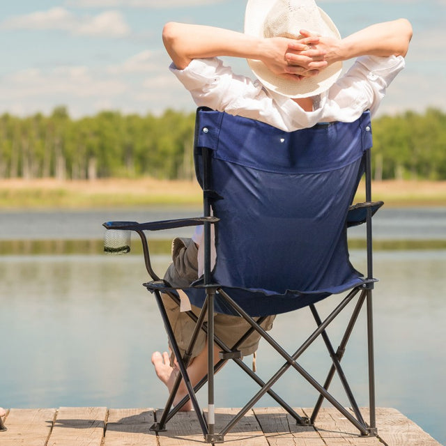 Durable folding chair with padded armrests, drink holders, and supportive steel frame, ideal for outdoor adventures.