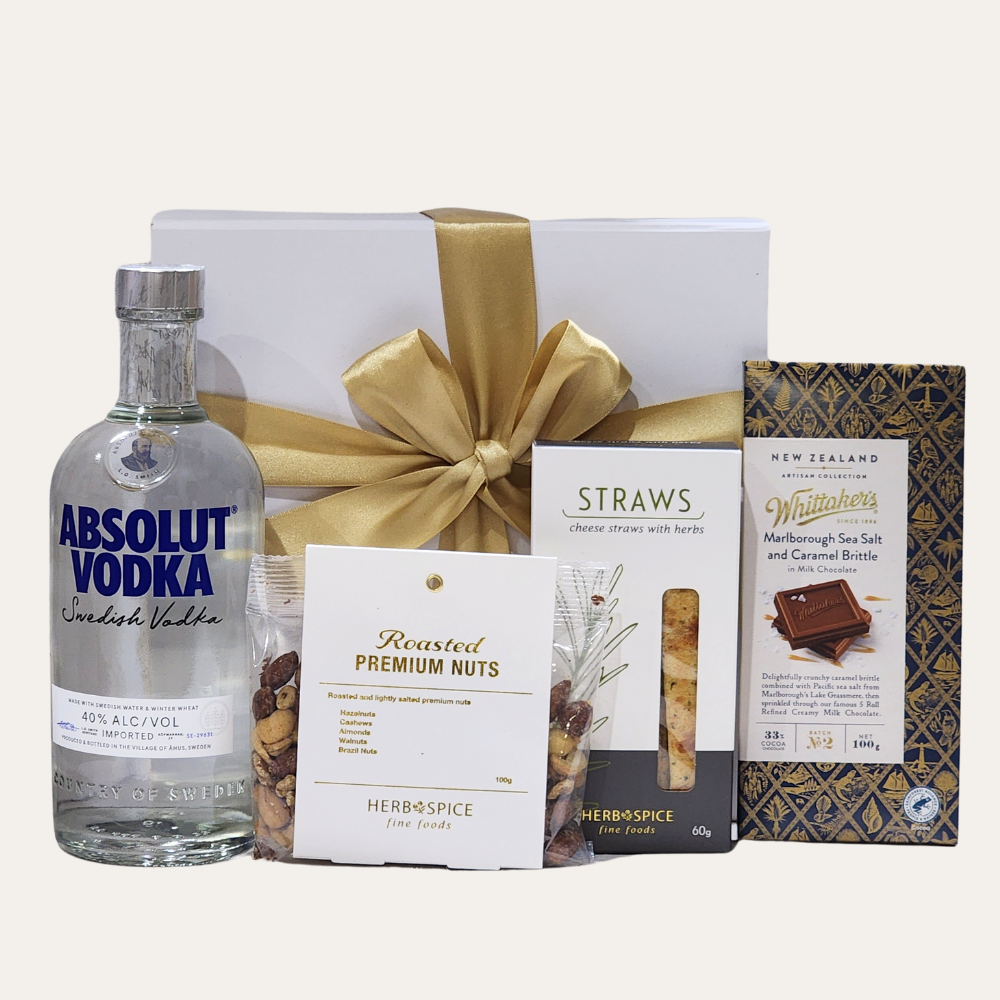 Luxurious Absolut Vodka gift set with gourmet snacks and elegant packaging, perfect for celebrations and special occasions.