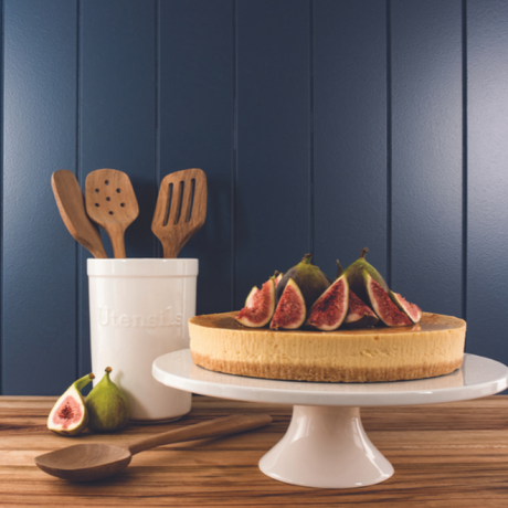 Elegant white bone china cake stand with classic design, perfect for showcasing desserts and enhancing table decor.