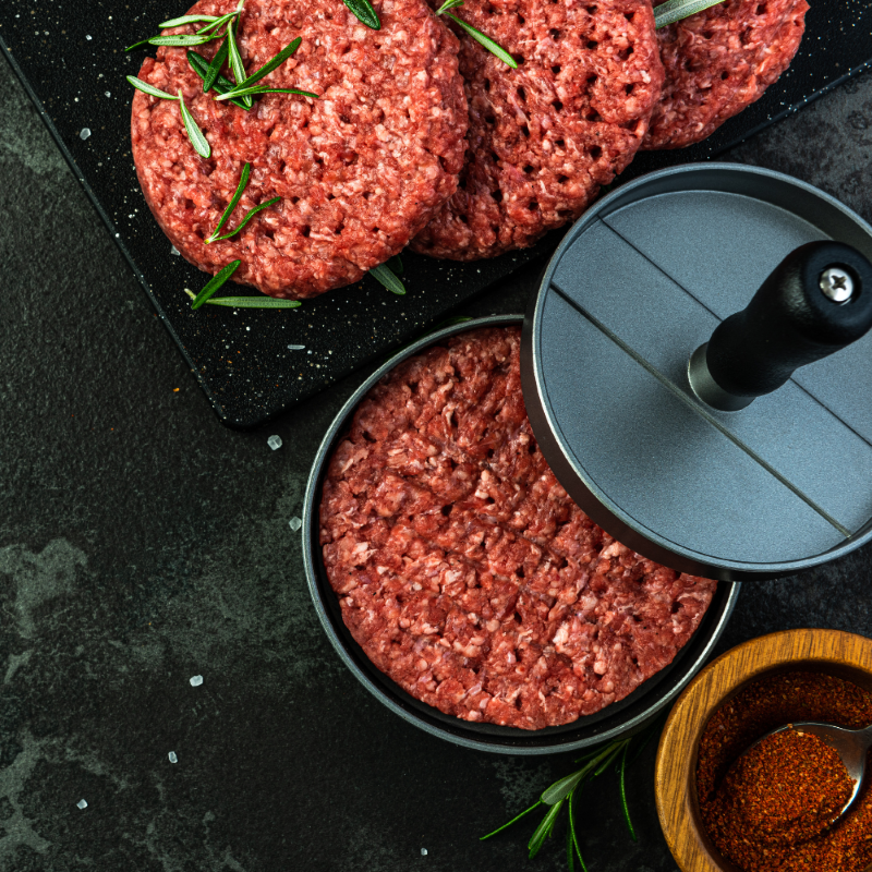 High-quality burger press for perfect 11.5cm patties, with a non-stick surface and ribbed design for enhanced flavor.
