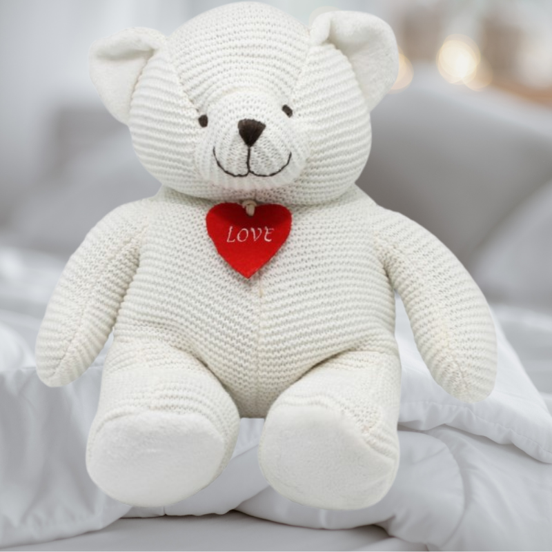 Large white plush bear with heart, featuring soft fur and a knitted layer, perfect for cuddles and heartfelt gifts.