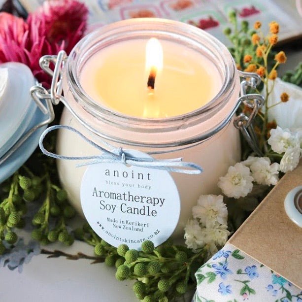 Calming soy candle with essential oils and crystals, promoting relaxation and tranquility for a soothing ambiance.