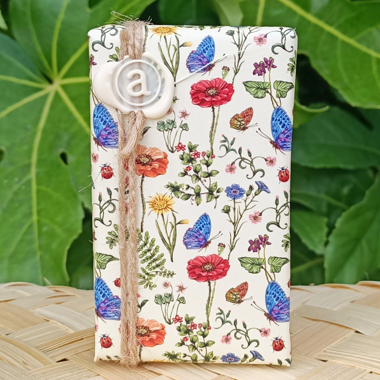 Luxurious Anoint Baby Shea Butter Soap wrapped in botanical paper, featuring nourishing ingredients for gentle cleansing.