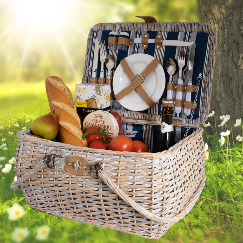 4-person picnic basket with willow wicker design, includes plates, cutlery, goblets, and insulated compartment for refreshments.