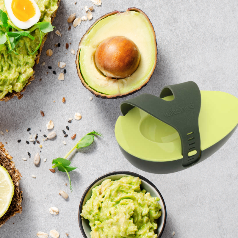Eco-friendly Avocado Saver designed to keep half avocados fresh, featuring an adjustable strap and dishwasher safe for easy cleaning.
