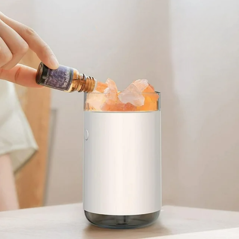 Aromatherapy diffuser with Himalayan salt crystals, featuring LED lights, essential oil diffusion, and ultrasonic humidification.