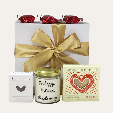 "Gift box with black raspberry & vanilla candle, gourmet fudge, and brownie bites for joyful celebrations."