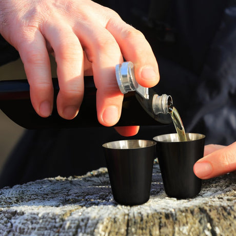 Elegant hip flask gift set featuring a 170ml stainless steel flask, two shot glasses, and funnel in a luxurious gift box.
