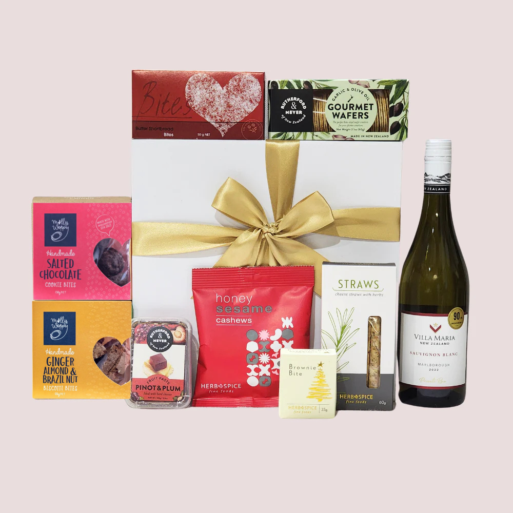 Aotearoa Delights Gift Box featuring gourmet treats, wine, and snacks representing New Zealand's unique flavors.