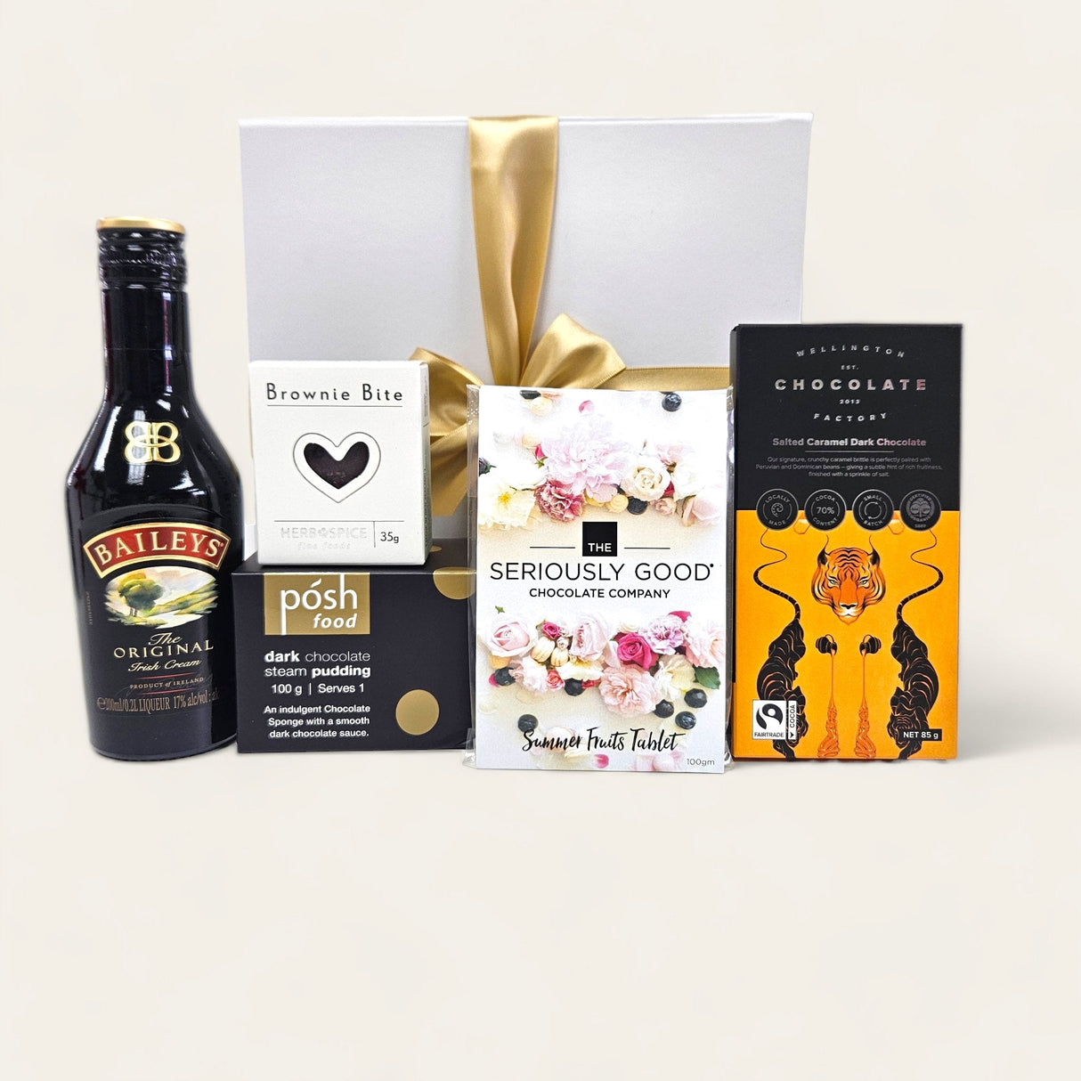 Elegant gift box featuring Baileys, assorted chocolates, and brownie bites for a luxurious indulgent experience.