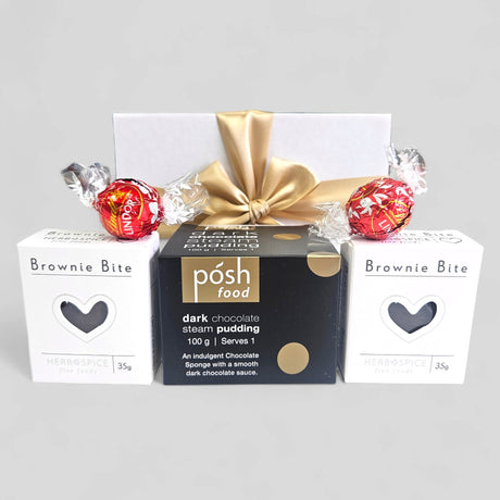 Choccy Dessert Gift Box featuring dark chocolate pudding, brownie bites, and Lindor truffles in an elegant ribboned package.