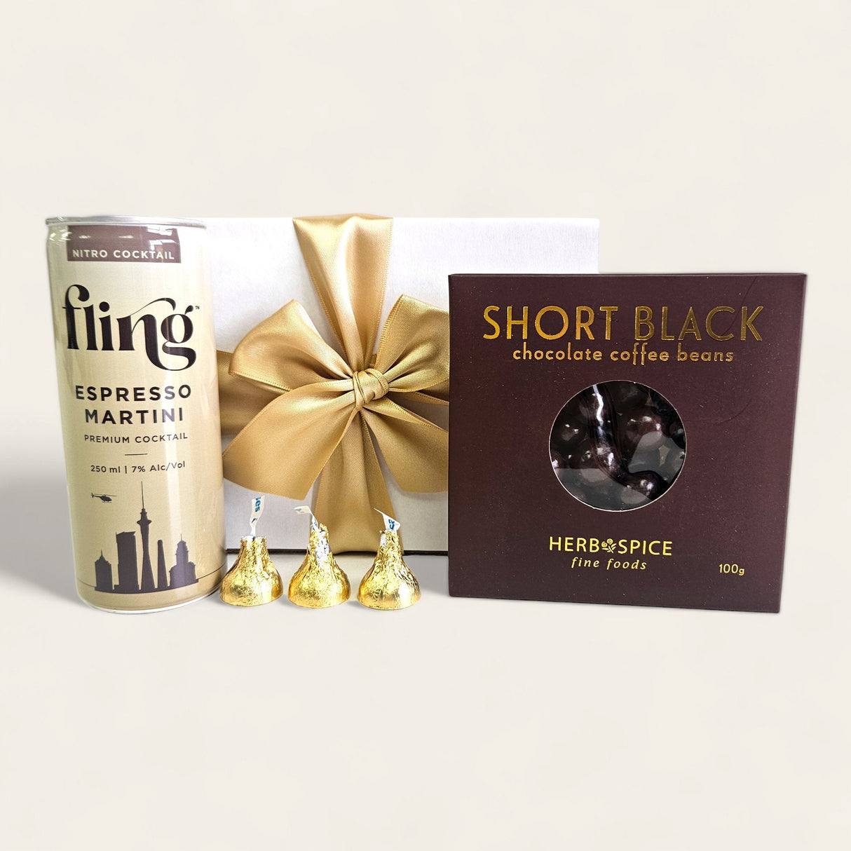 Gift box featuring Espresso Martini, chocolate-coated coffee beans, and Hershey's Kisses in elegant packaging.