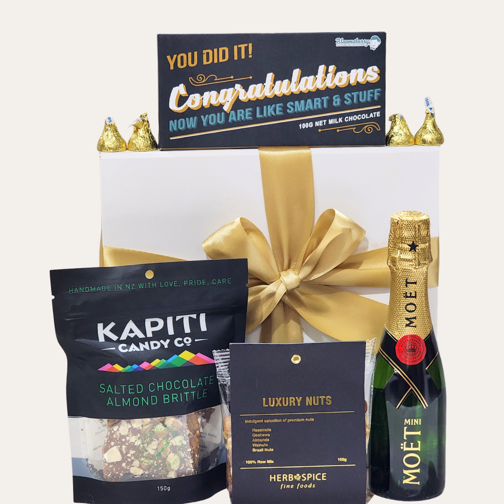 Elegant gift box featuring Moët champagne, gourmet chocolates, and premium nuts for celebrating achievements in style.