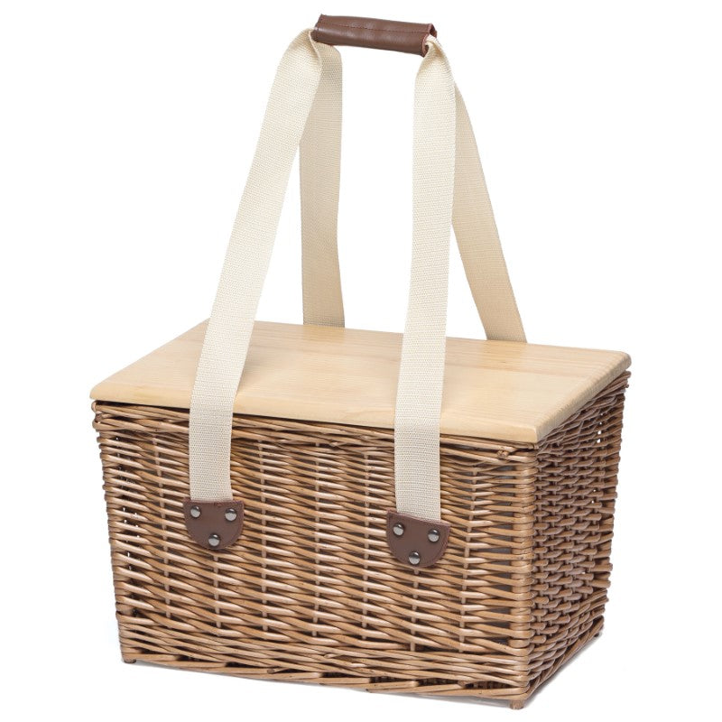 Stylish wicker picnic basket with insulated cooler, removable serving board lid, and elegant leather handles for outdoor adventures.