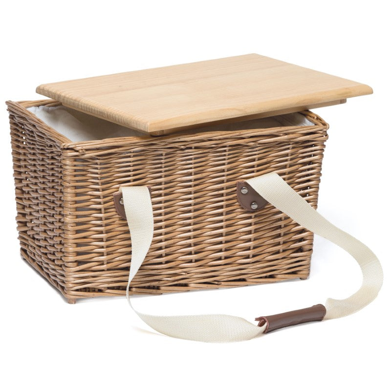 Stylish picnic basket with insulated cooler, removable pine lid serving board, and durable leather-wrapped handles.