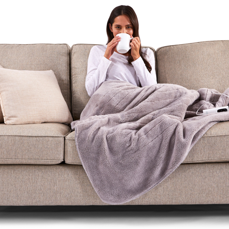 Heated Sherpa Throw Blanket providing adjustable warmth, safety features, and fast heating for ultimate comfort and relaxation.
