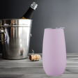 Pink double wall insulated champagne tumbler (180ml) with lid; maintains beverage temperature, stylish and perfect for outdoor use.