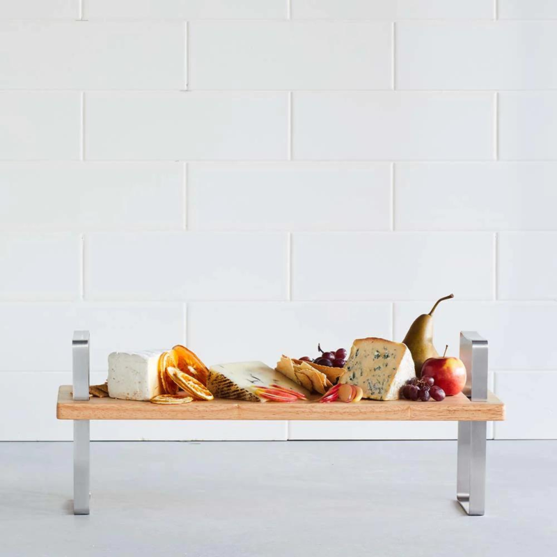Stylish multi-height serving board with adjustable legs for elegant food presentation, perfect for any gathering.