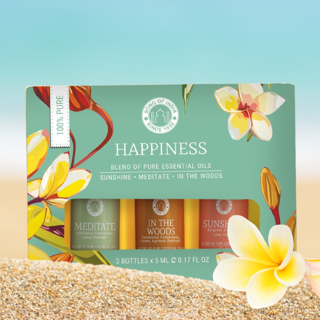 Happiness Essential Oil Gift Pack featuring uplifting blends like SUNSHINE, MEDITATE, and IN THE WOODS for positivity and calm.