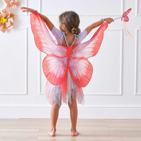 Vibrant red and lilac butterfly wings for kids, featuring satin straps, perfect for imaginative play and dress-up adventures.