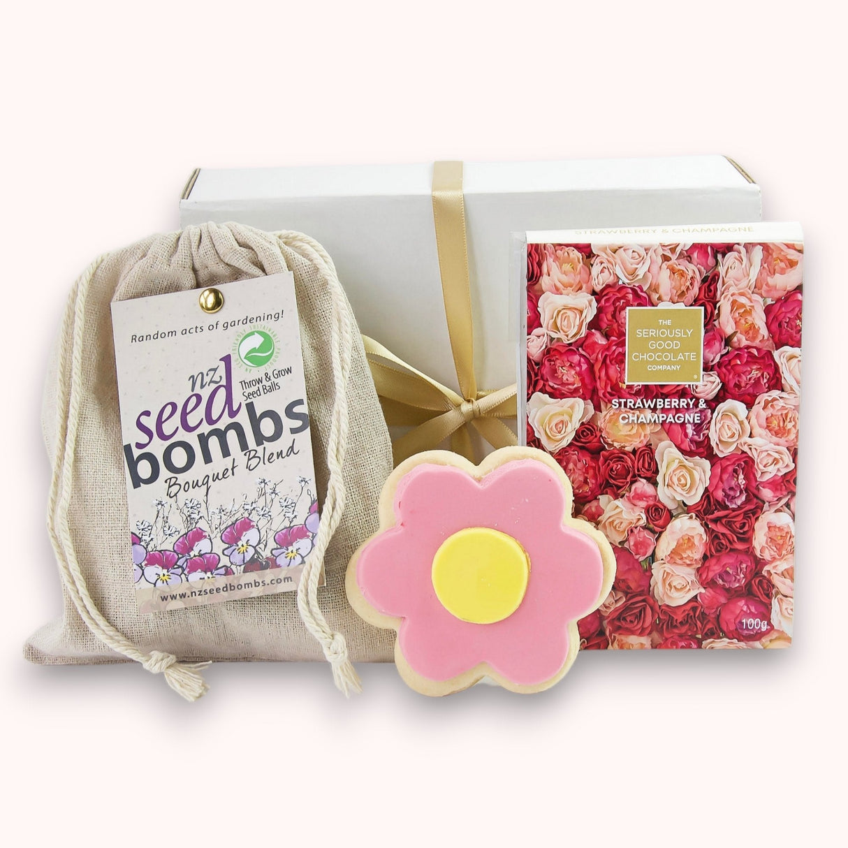 Charming Flower Power Gift Box with seed bombs, gourmet chocolate, and iced shortbread for thoughtful gifting.