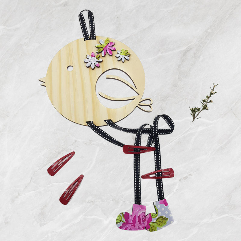 Eco-friendly hair clip tidy made from pine veneer, designed to organize clips and enhance a child's bedroom decor.