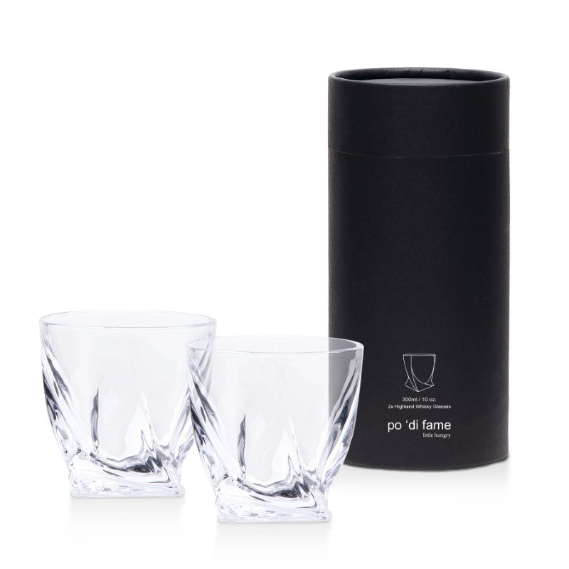 Elegant whiskey glass set featuring curved designs, stable faceted bases, and a stylish gift box, ideal for connoisseurs.