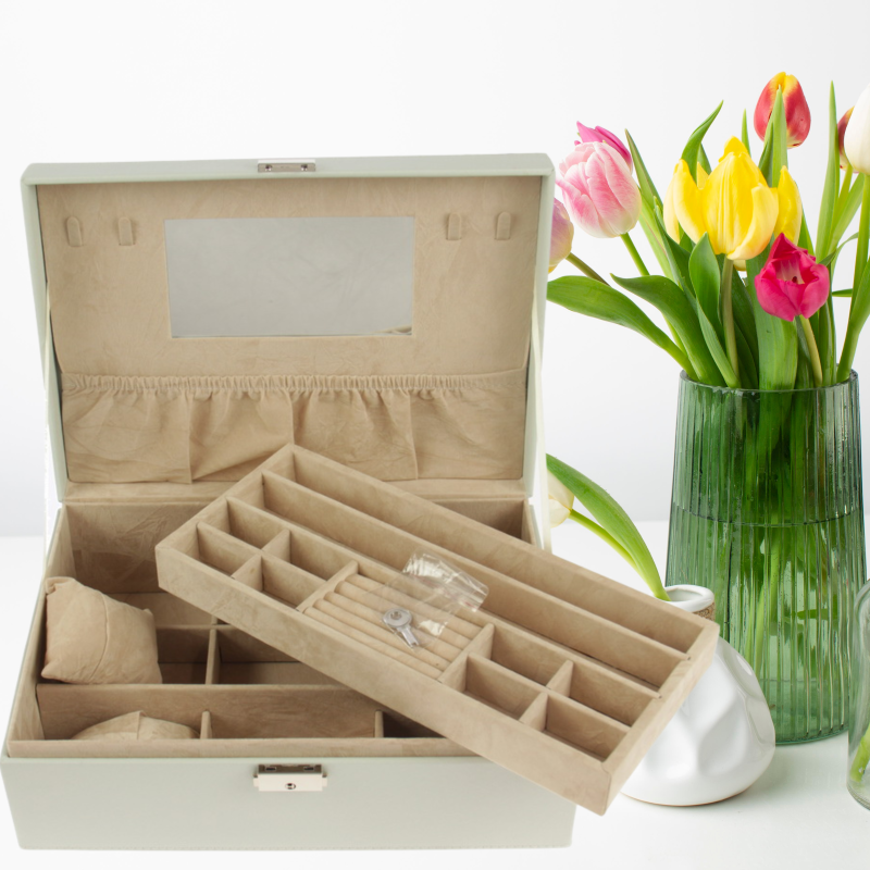Elegant multi-compartment jewellery box with removable tray, internal mirror, and secure key for organized accessory storage.