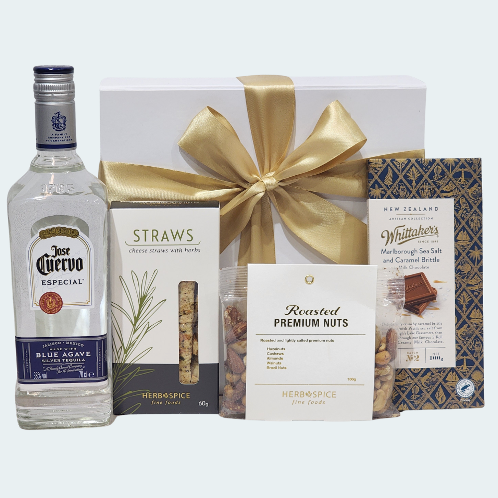 Luxurious gift box featuring José Cuervo Especial Silver Tequila, gourmet snacks, and elegant packaging for special celebrations.
