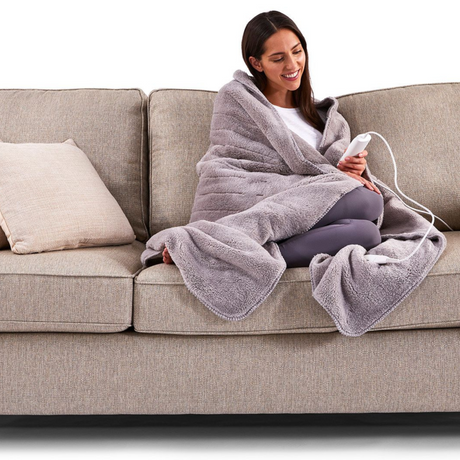 Heated Sherpa throw blanket with adjustable heat, safety features, and fast warming for ultimate cozy comfort at home.