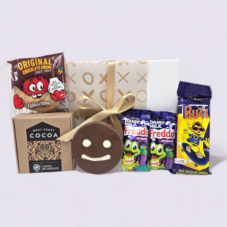 Colorful gift box filled with chocolates, cookies, and hot chocolate, perfect for kids and chocoholics to spread joy.